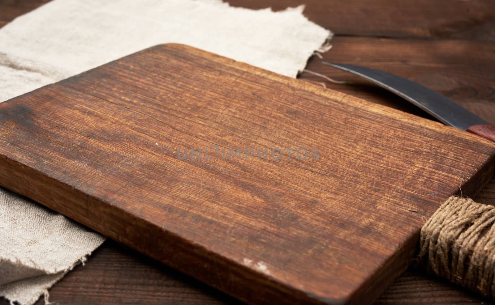 very old empty wooden rectangular cutting board and knife by ndanko