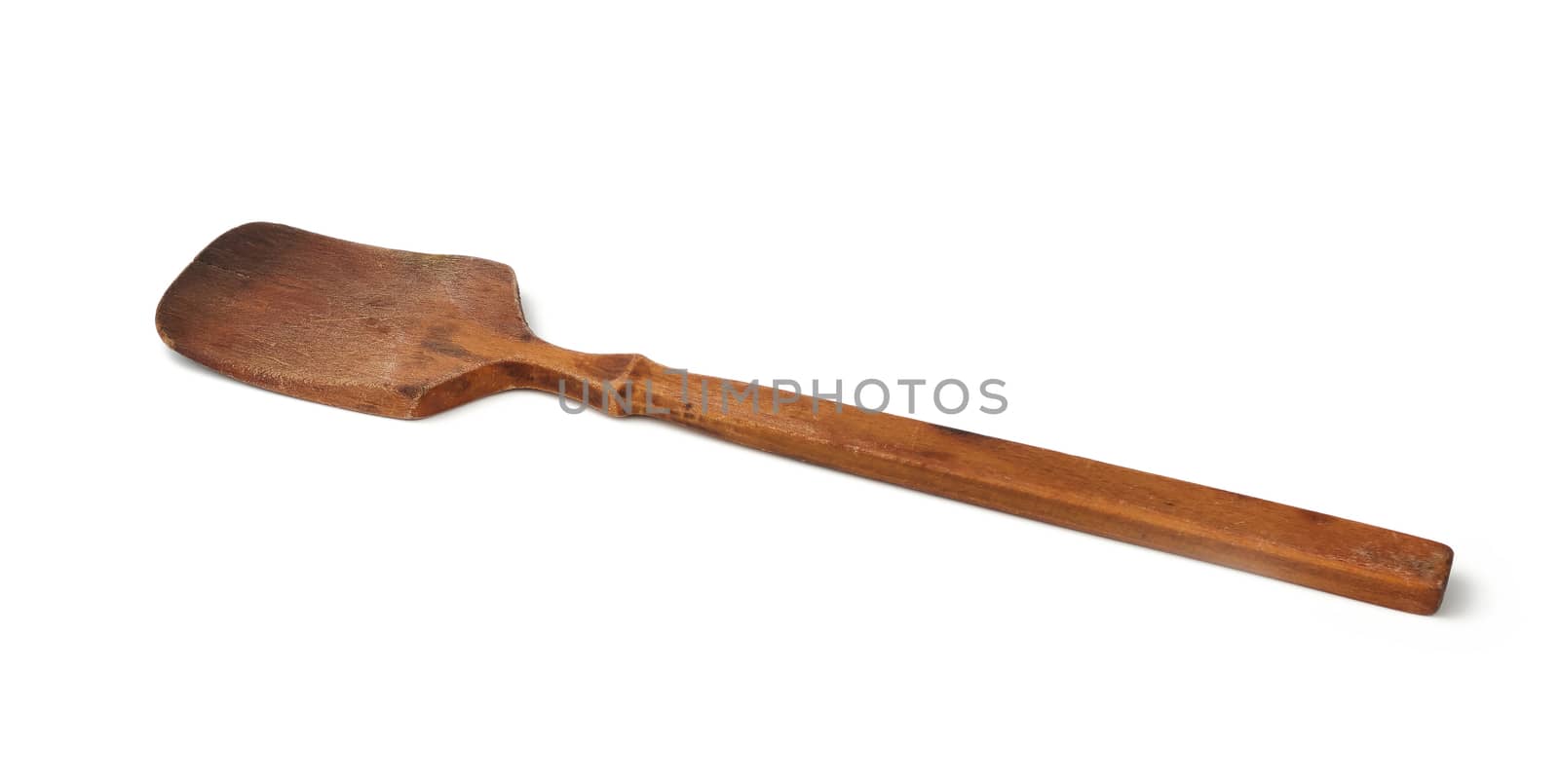 old used wooden kitchen spatula for stirring dishes isolated on white background, close up