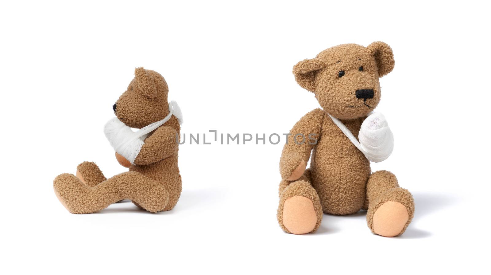 funny vintage brown curly teddy bear with rewound paw with white gauze bandage isolated on white background, concept of injuries in children or animals, set