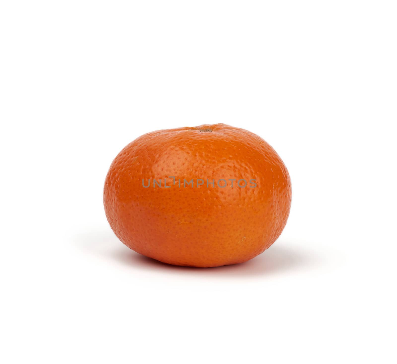 ripe round tangerine in peel isolated on a white background, close up