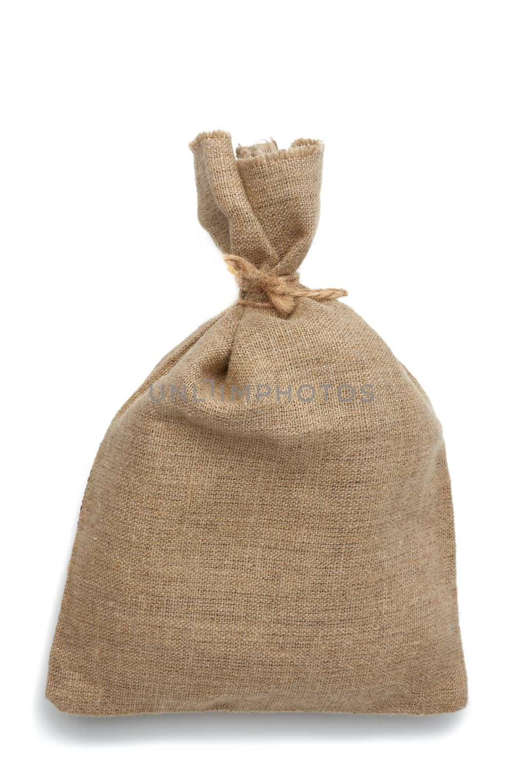 full canvas bag tied with rope and isolated on a white background, close up