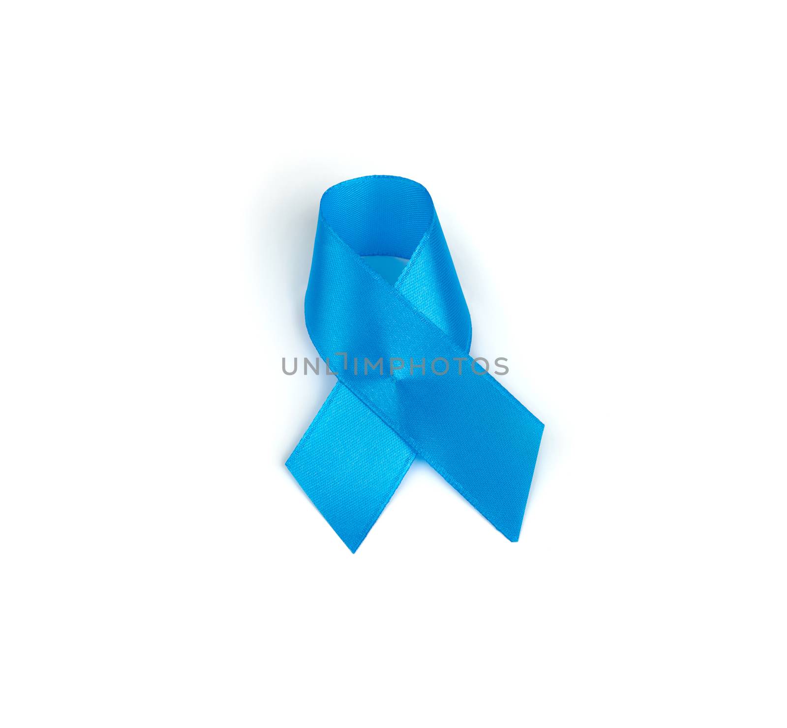 blue silk ribbon wrapped in a loop and isolated on a white background, prostate cancer awareness symbol, close up