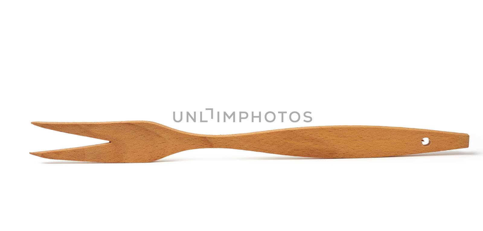 wooden yellow fork isolated on white background, vintage appliance, close up