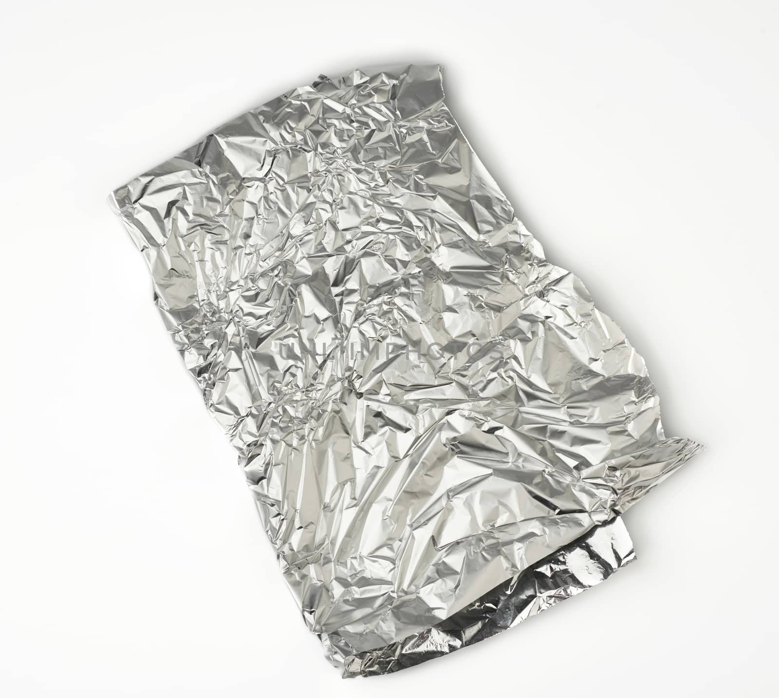 frosted crumpled piece of foil on white background, packaging material for food and objects