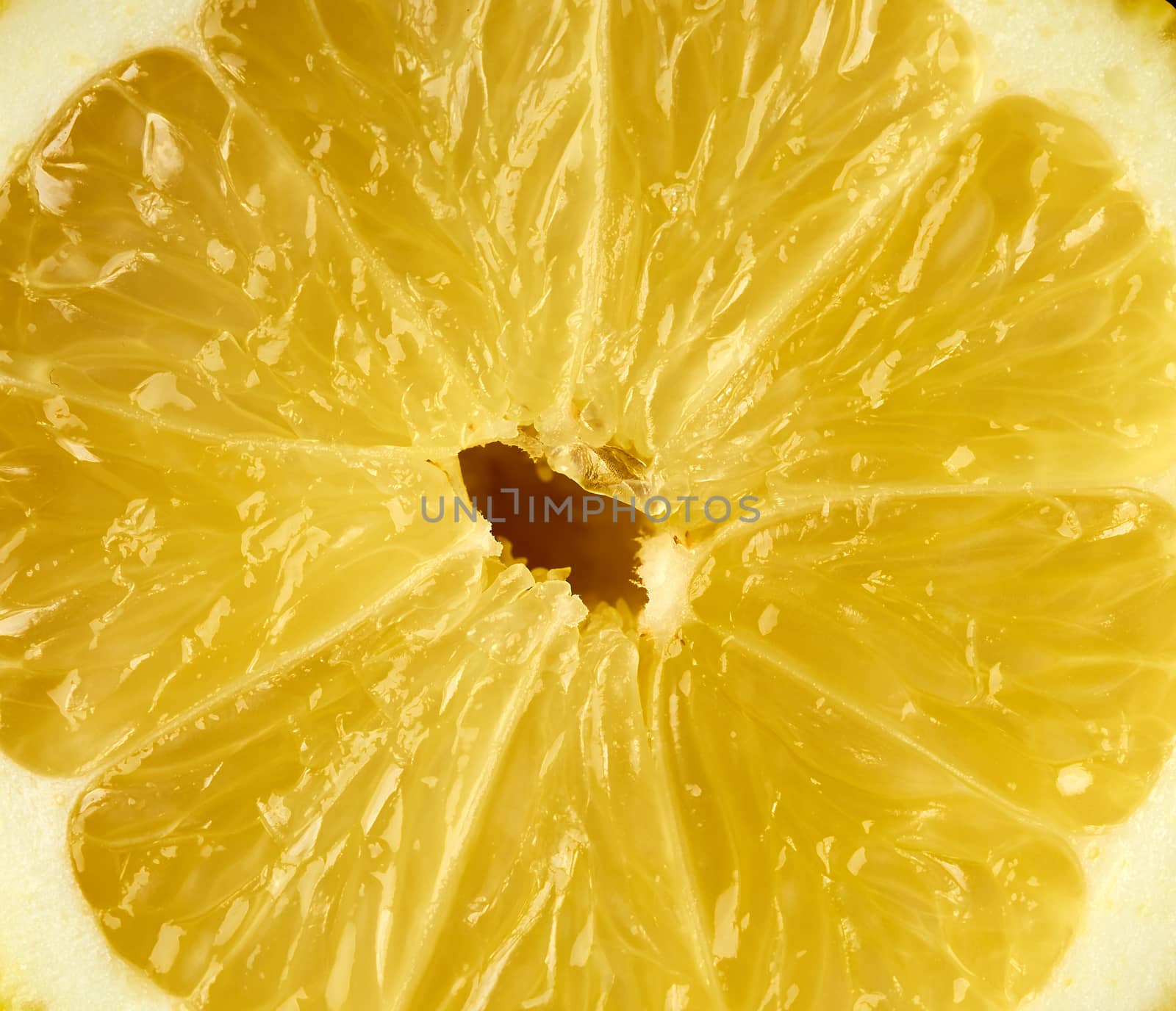 texture of half a yellow ripe lemon, full frame, close up