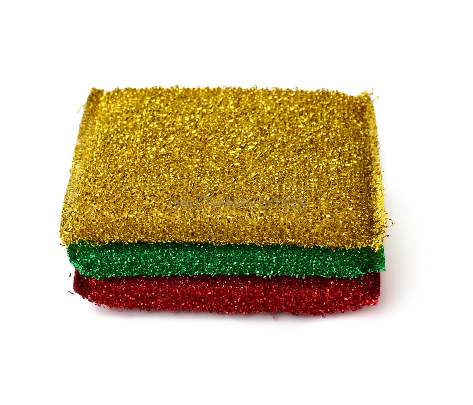 stack of new multi-colored kitchen sponges for washing dishes on a white background, close up