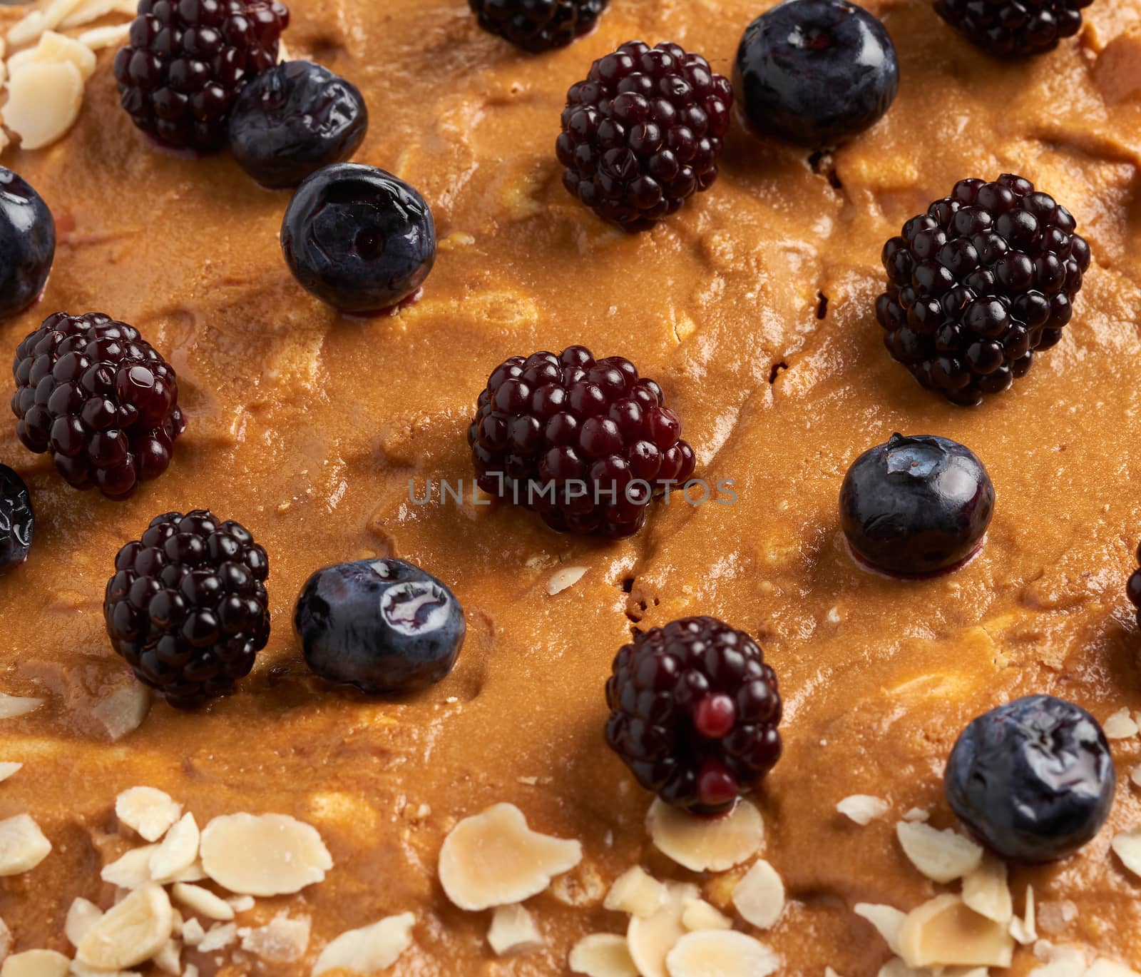 meringue pie texture decorated with berries, full frame, close up