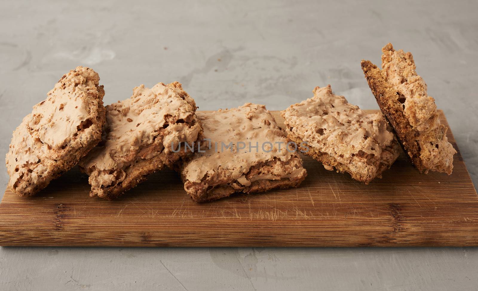 baked Krakow meringue cookies on a wooden board, delicious dessert of whipped egg whites and almond flour