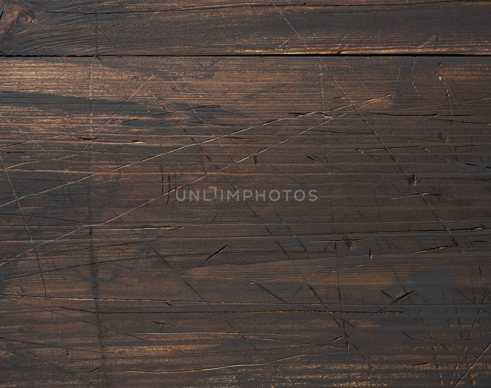 Background of brown wooden boards with cracks, scuffs. Backdrop for compositions, rustic
