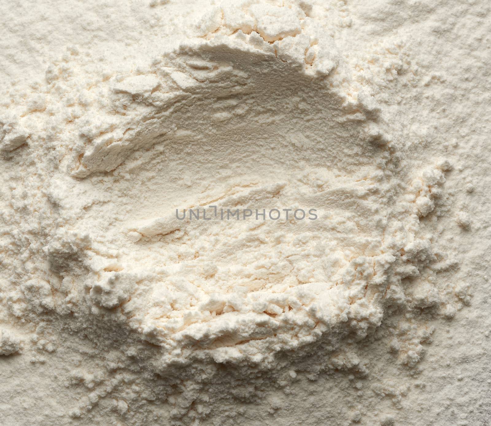 white wheat flour scattered, top view, funnel for liquid ingredients, close up