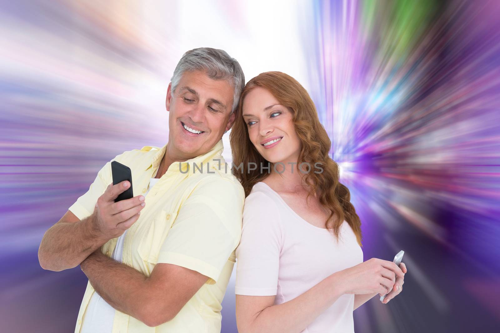 Composite image of casual couples on their phones by Wavebreakmedia
