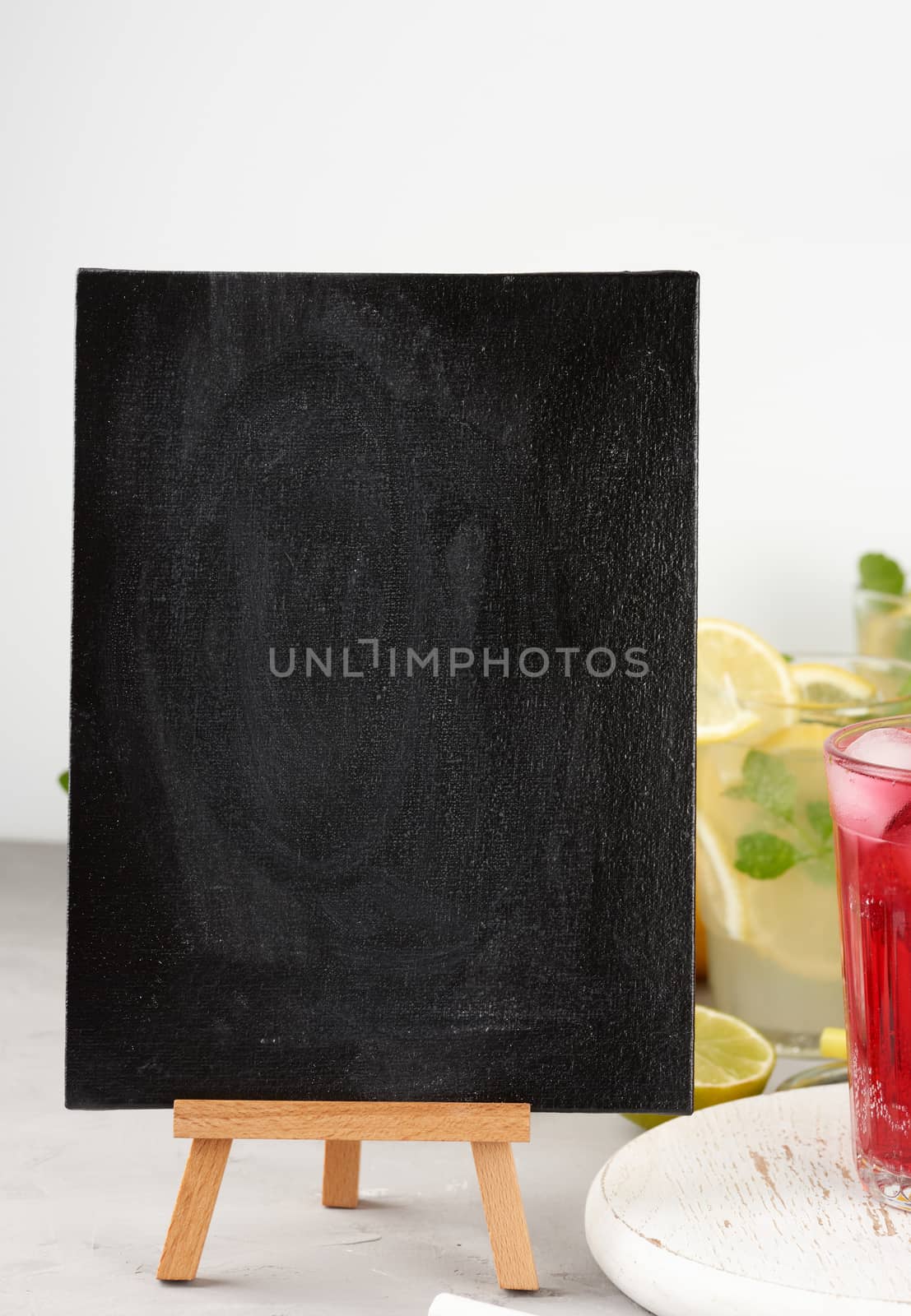 empty black chalk board for writing a summer drink recipe by ndanko