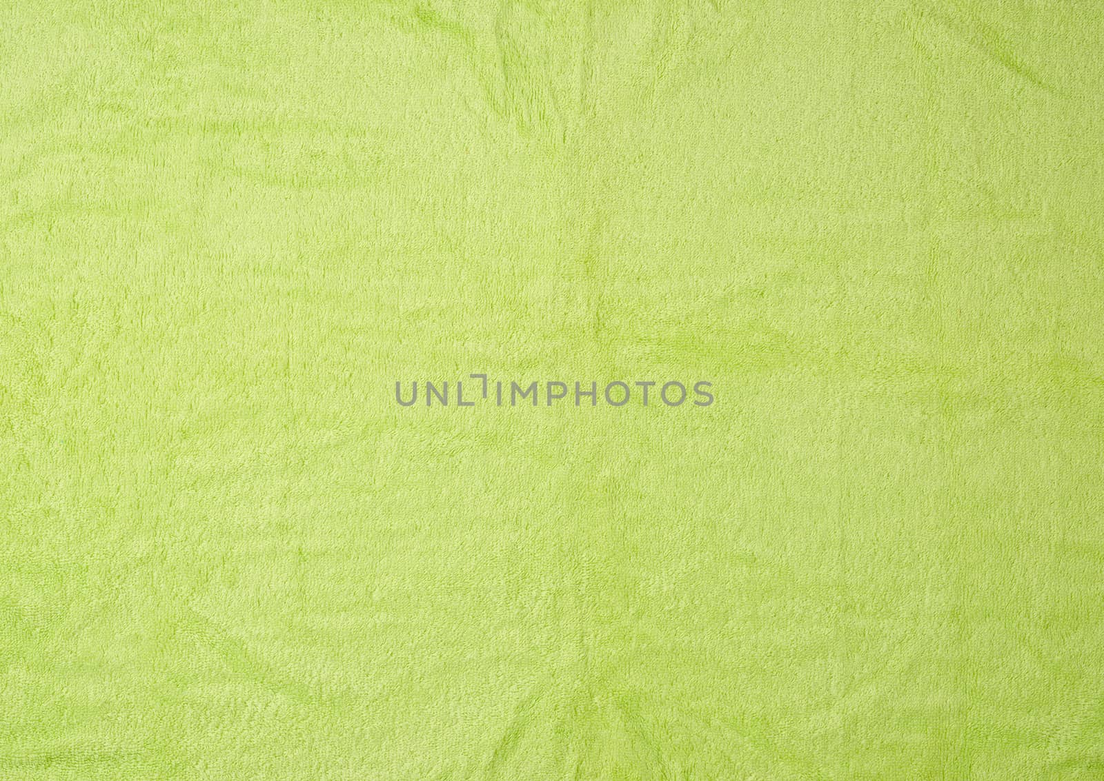 texture of fleecy bright green towels, full frame, close up