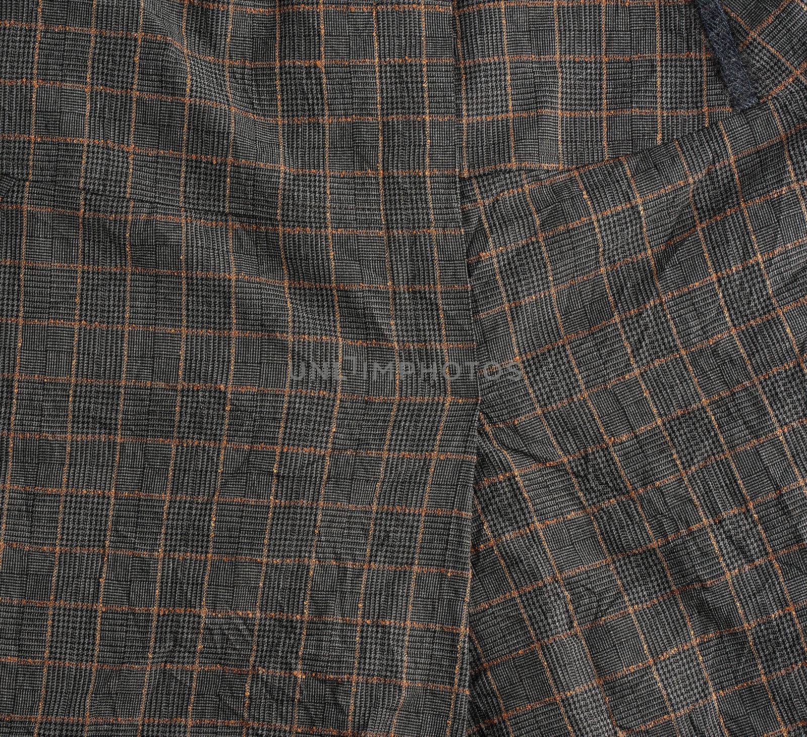 textile gray wool checkered fabric, fabric for tailoring suits and skirts, close up