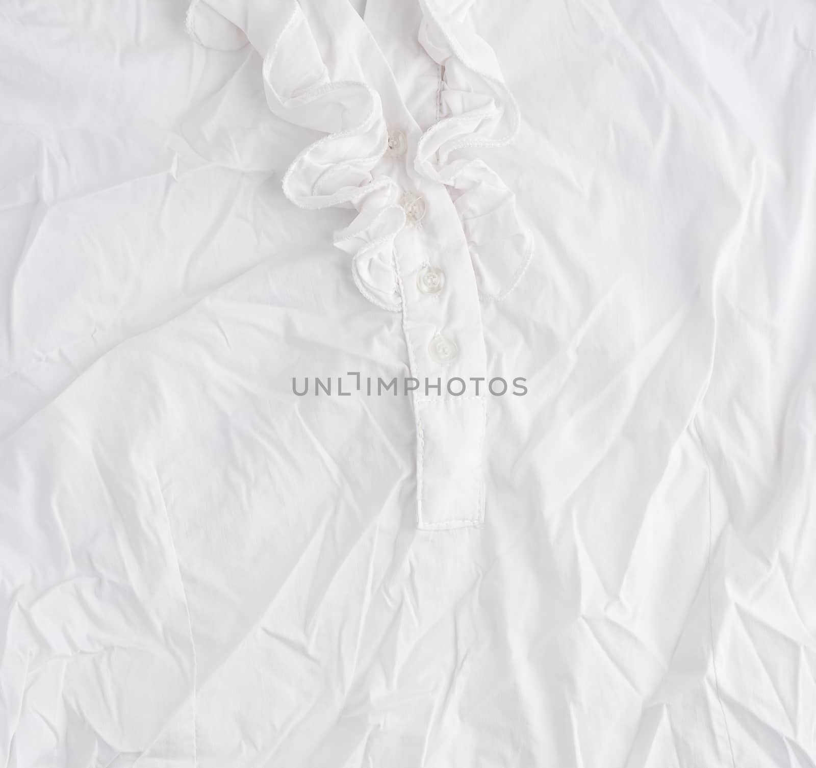 fragment of a white cotton blouse with buttons, full frame