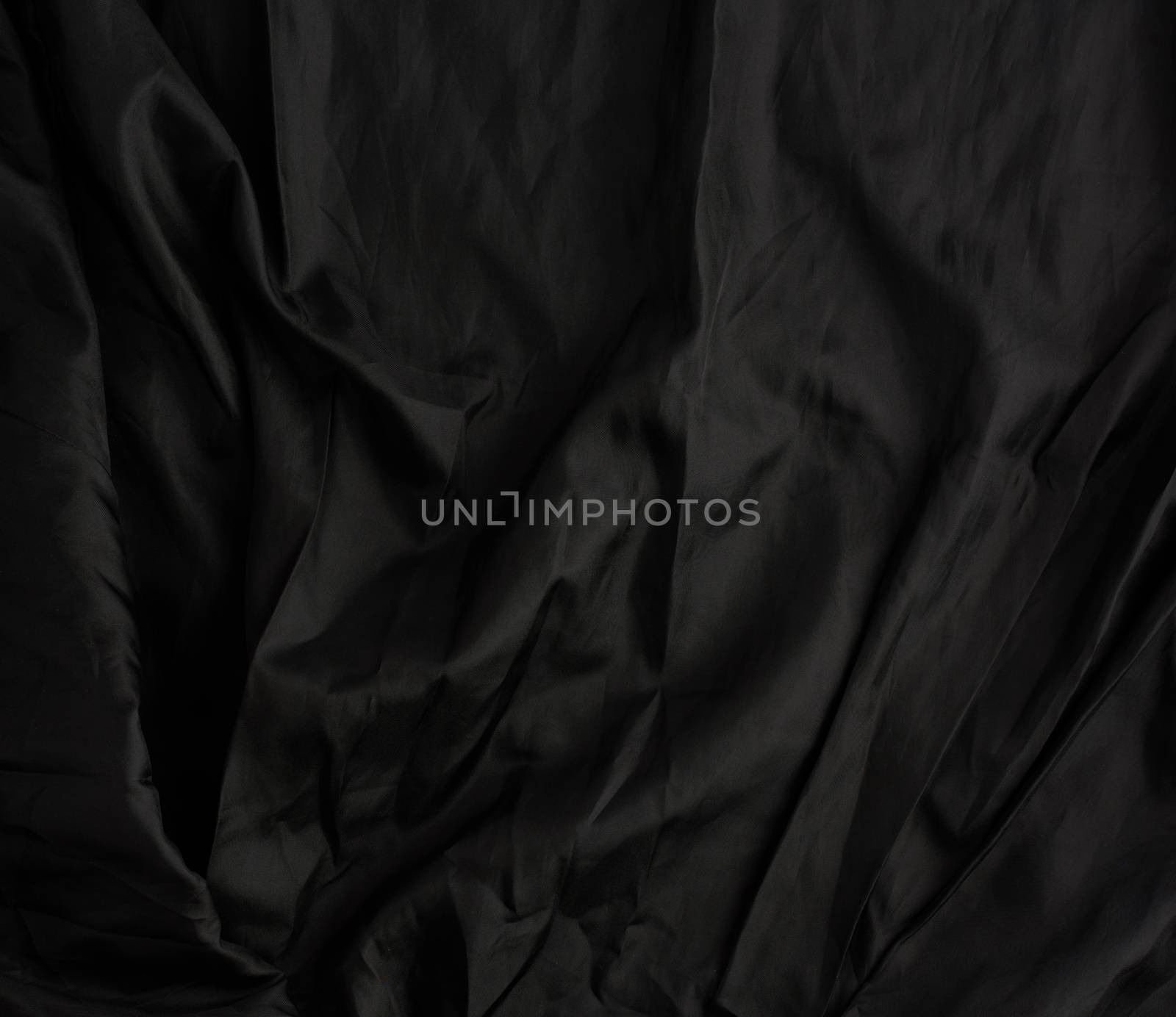 texture of black cotton fabric with waves, full frame, fabric for sewing clothes, shirts. Design Element