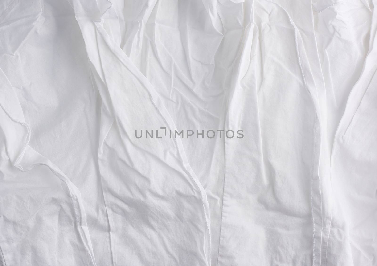 crumpled white cotton fabric, fabric for sewing clothes and shirts, full frame