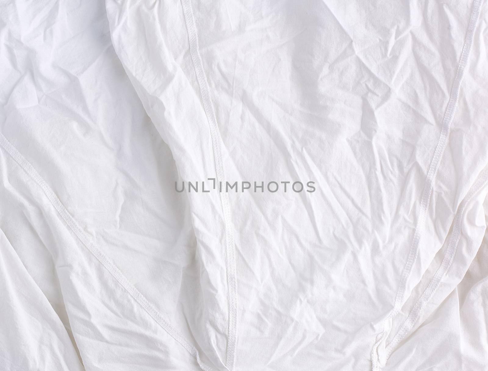 crumpled white cotton fabric, fabric for sewing clothes and shirts, full frame