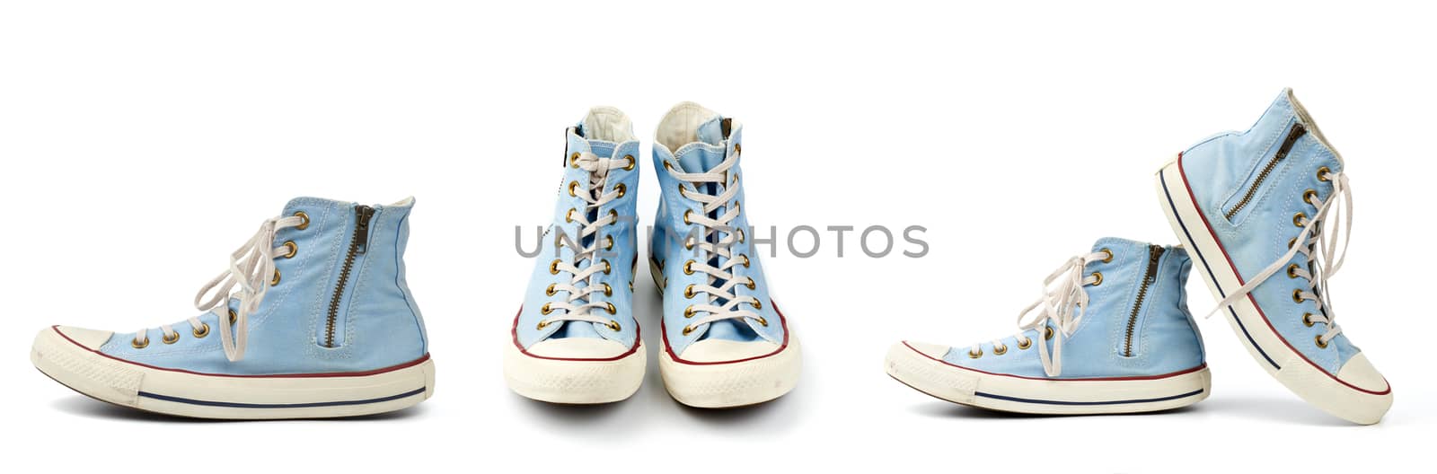pair of light blue worn textile sneakers with laces and zippers  by ndanko