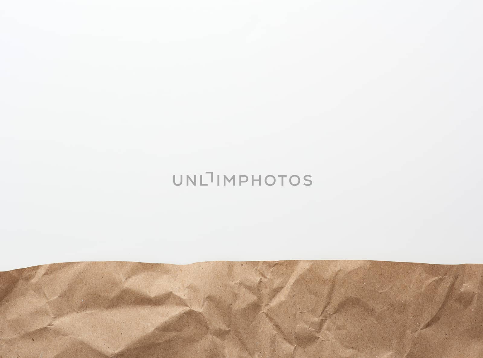 brown pieces of parchment paper on a white background, flat lay, copy space