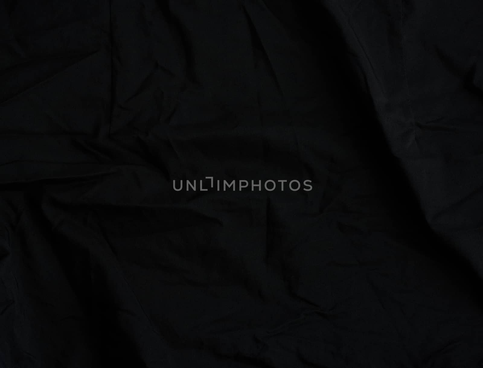 texture of black cotton fabric with waves, full frame, fabric for sewing clothes, shirts. Design Element