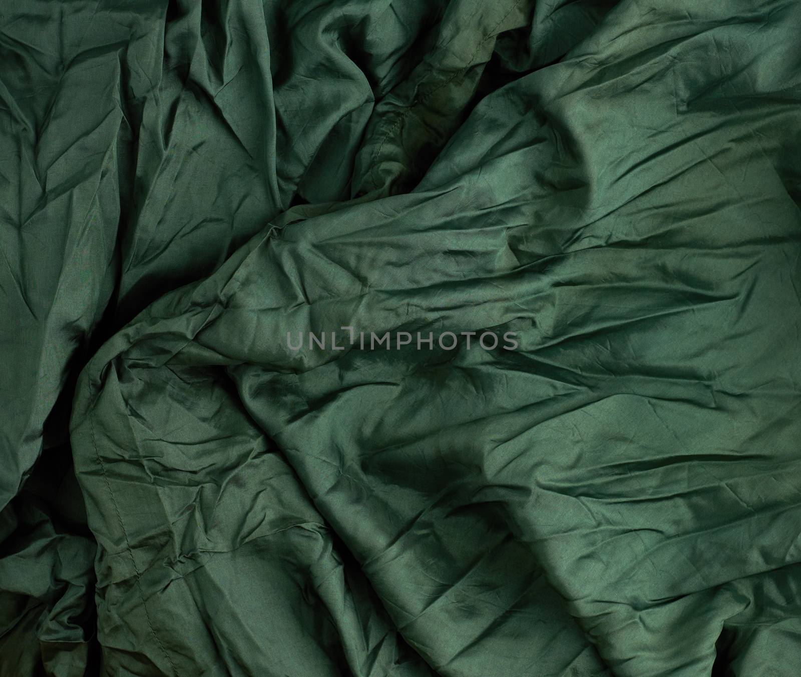 green satin textile fabric, piece of fabric for sewing curtains and things, full frame