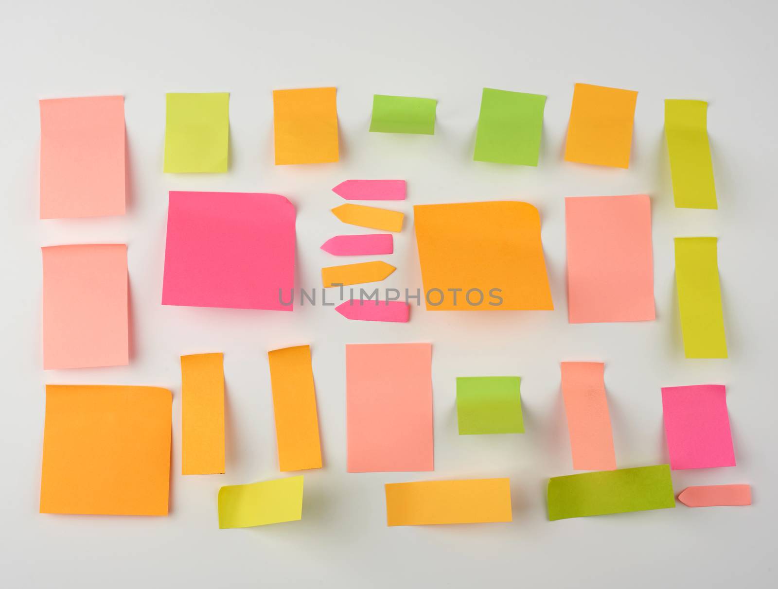 multicolored blank paper stickers of different sizes and shapes on a white background