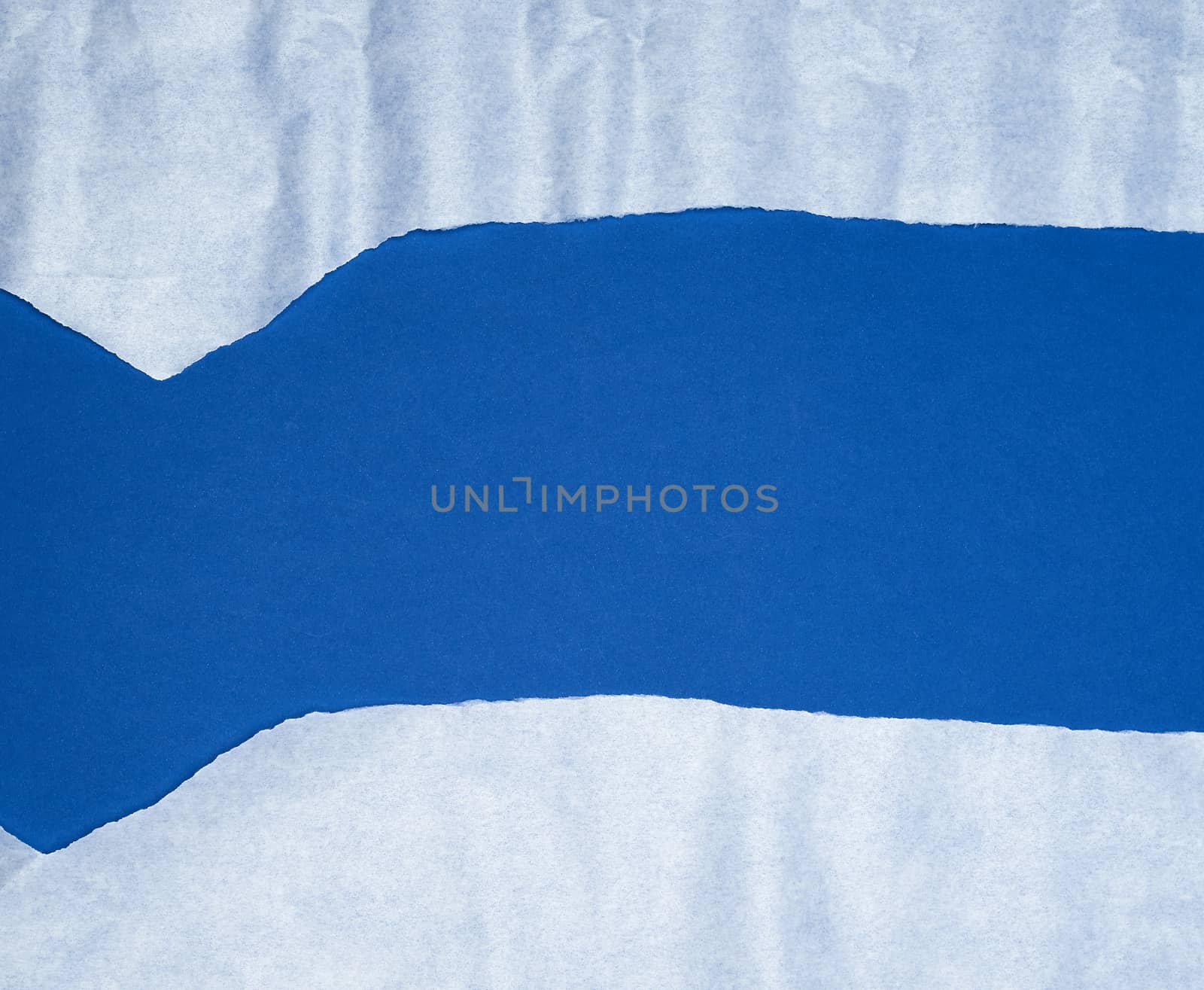 blue background with white crumpled torn paper elements, place for writing op in the middle, template
