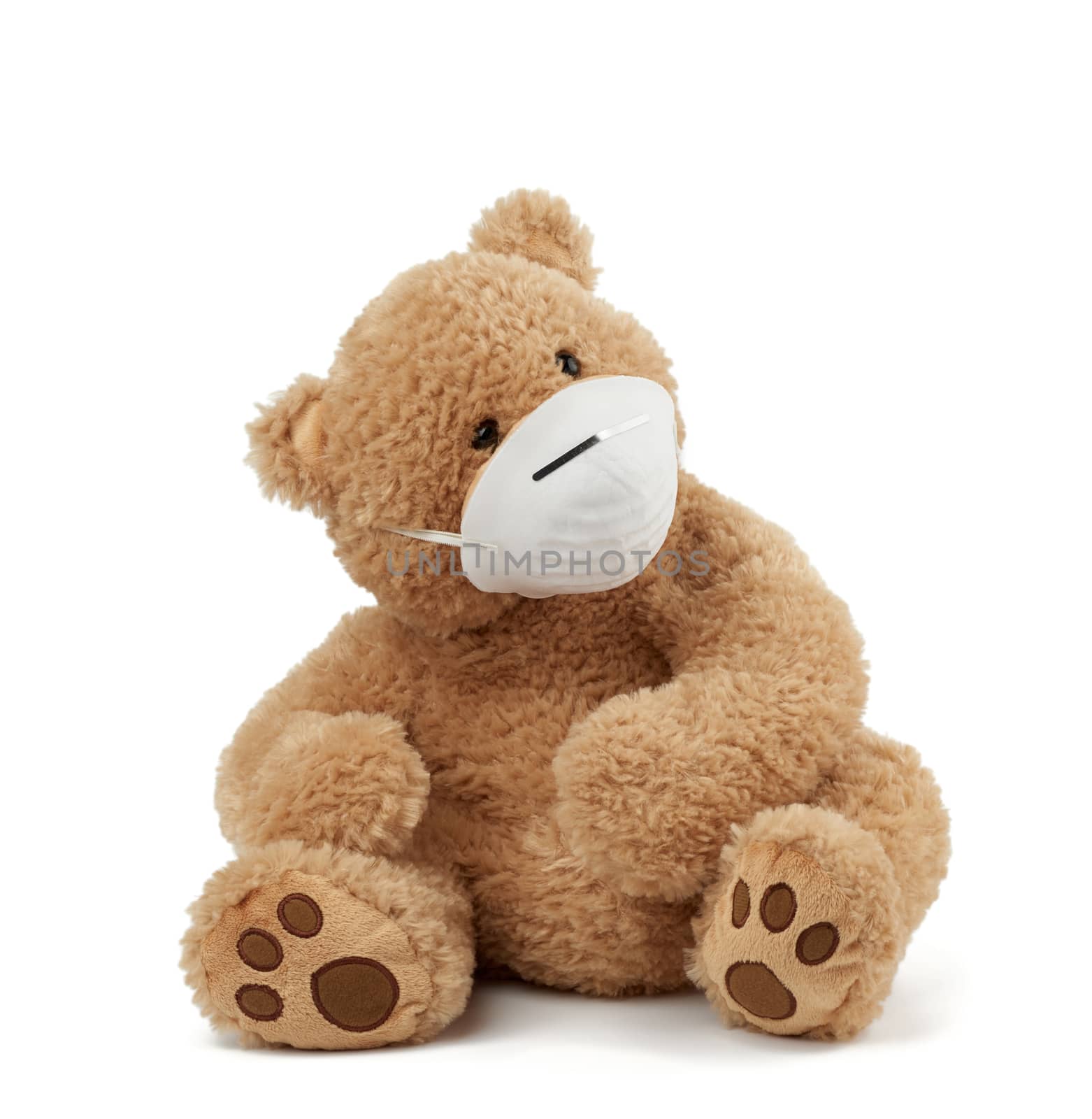 big teddy bear are sitting in medical masks on a white background, concept of protection from respiratory disease, virus and individual respiratory protection