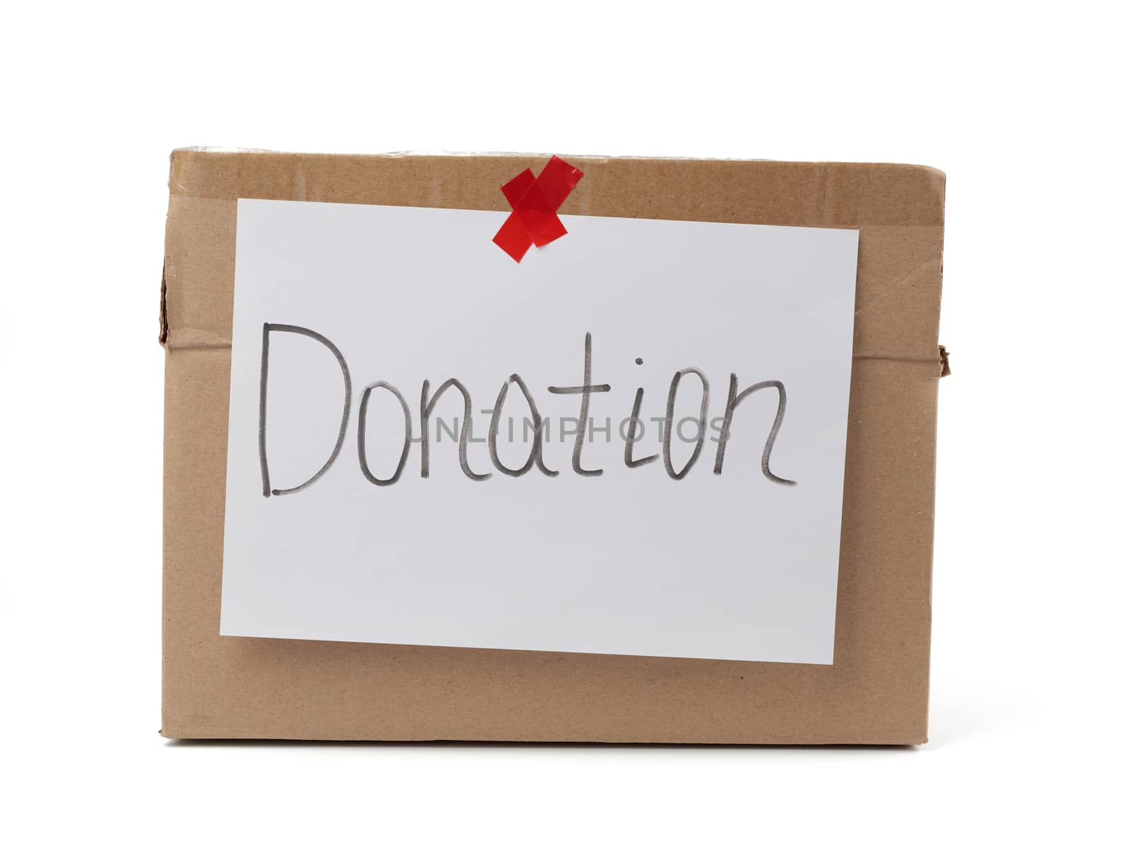 brown cardboard box with a pasted white sheet and the inscription donation on a white background, help concept