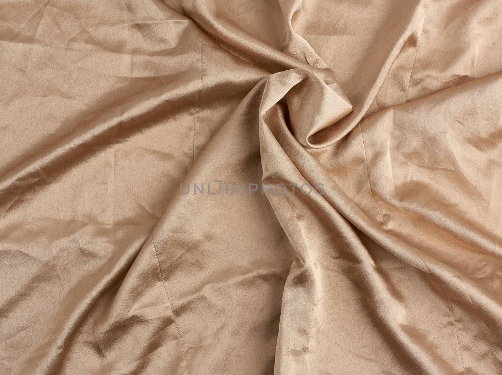 beige satin textile fabric, piece of canvas for sewing curtains and things, full frame. Crumpled textile satin, great design for any purposes.