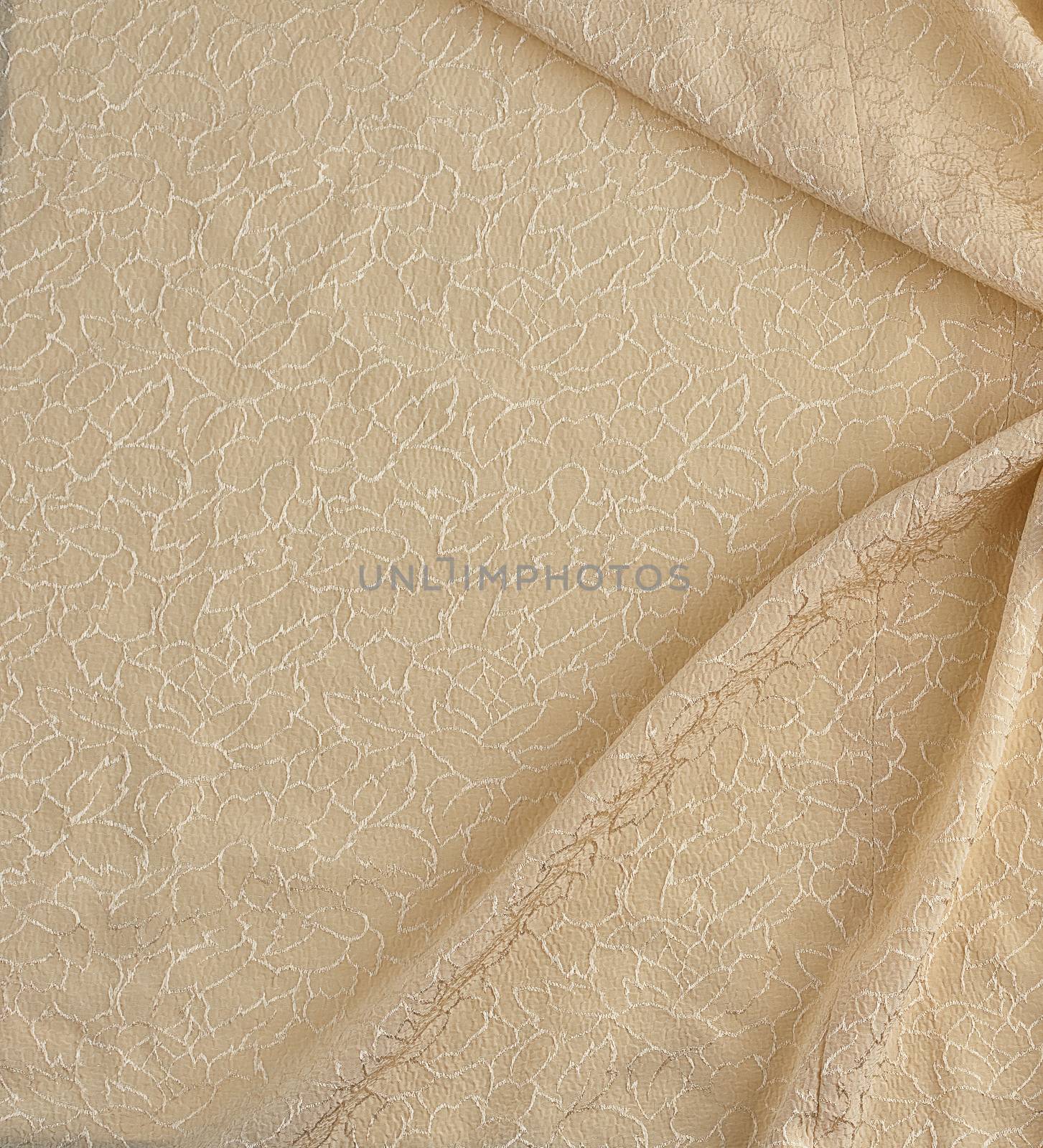 beige satin textile fabric with embroidery elements, piece of canvas for sewing curtains and things, full frame. Crumpled textile satin, great design for any purposes.