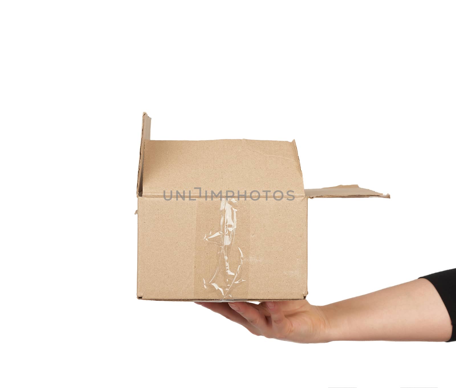 hand holds a brown cardboard box of paper on a white isolated background, moving concept