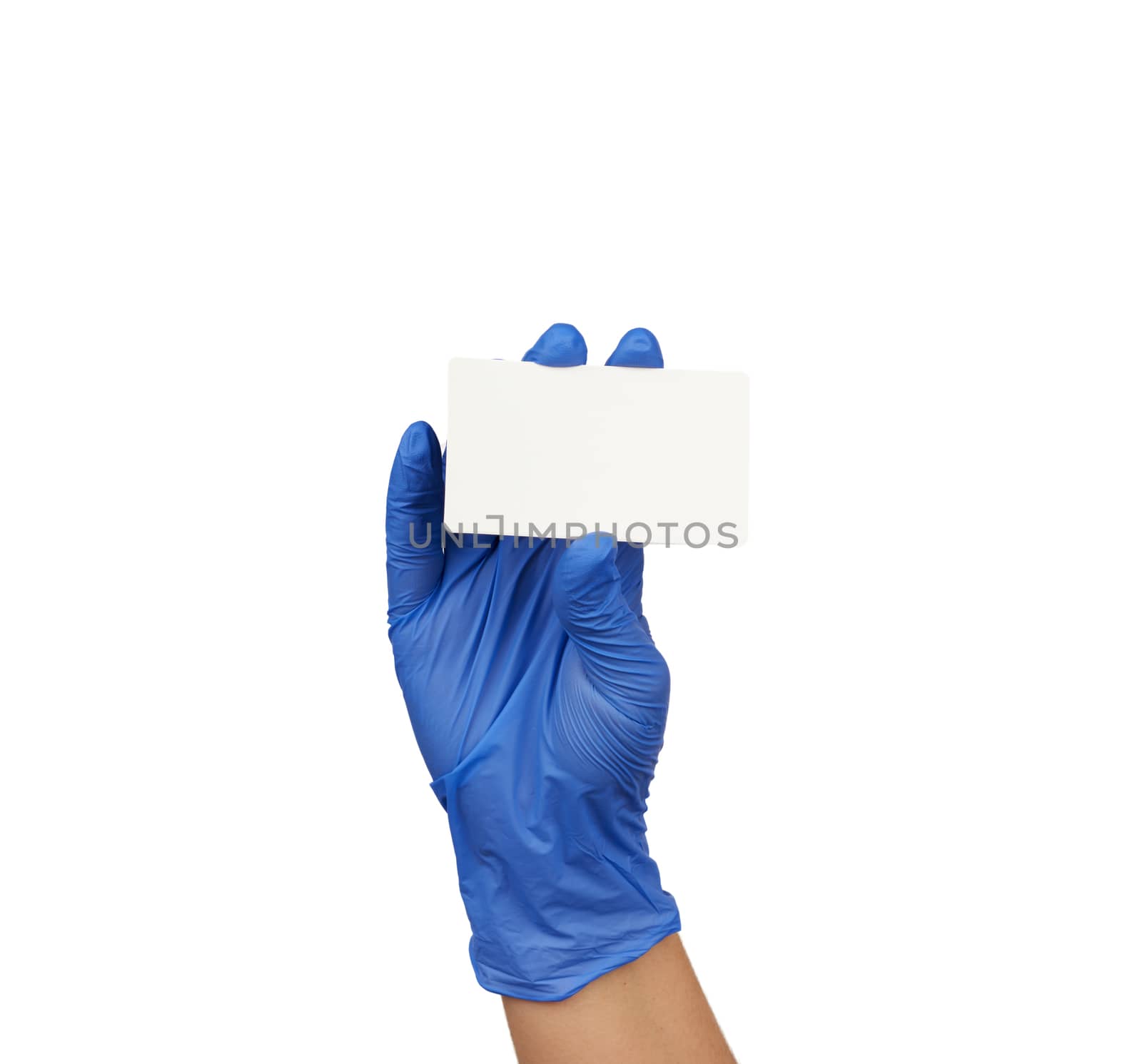 hand wearing a blue latex medical glove holds a white paper rectangular business card, place for an inscription