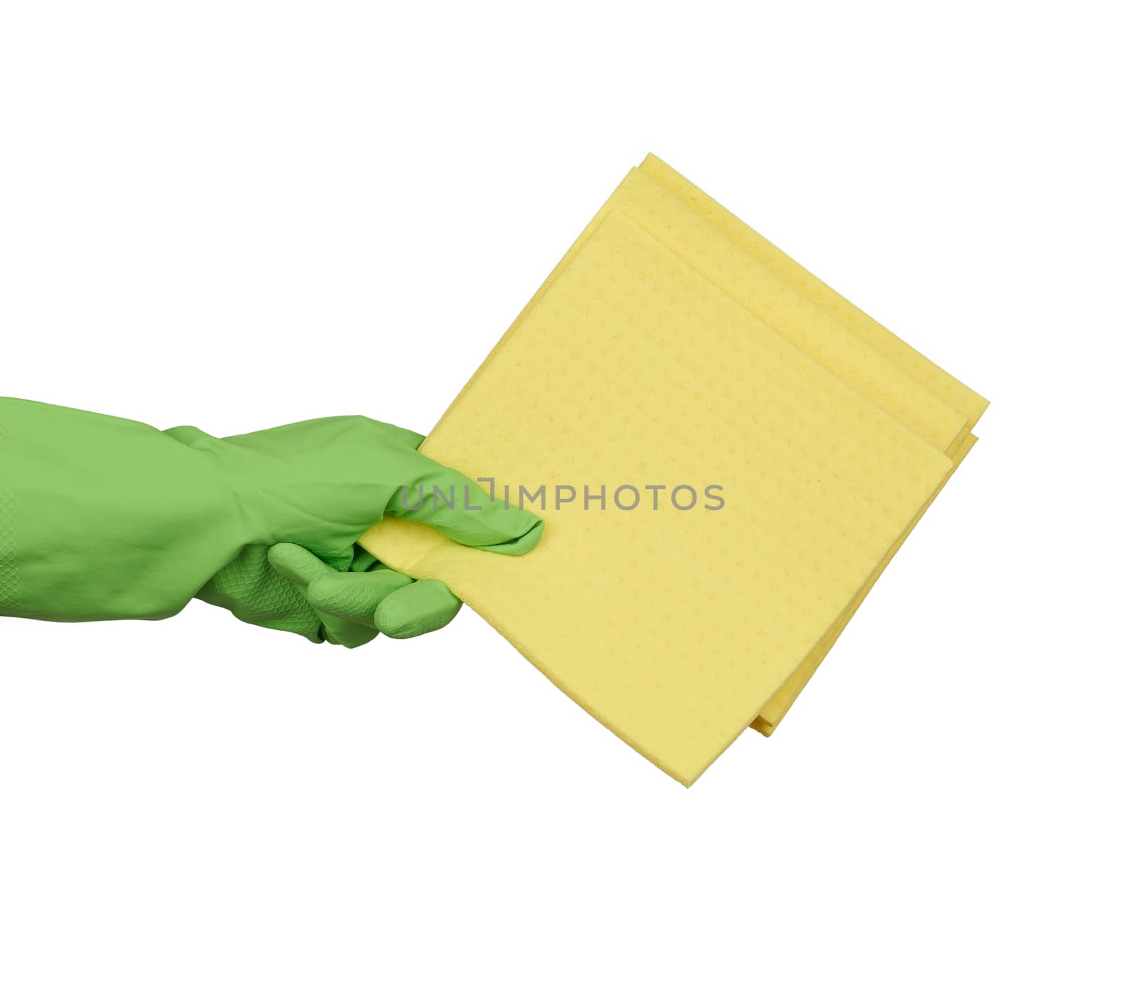 hand holds a yellow rag sponge for cleaning, protective green rubber glove is worn on the arm, part of the body is isolated on a white background