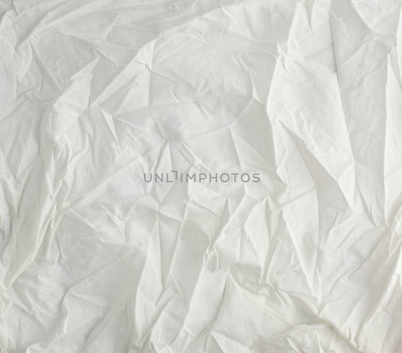 crumpled white cotton fabric, fabric for sewing clothes and shirts, full frame