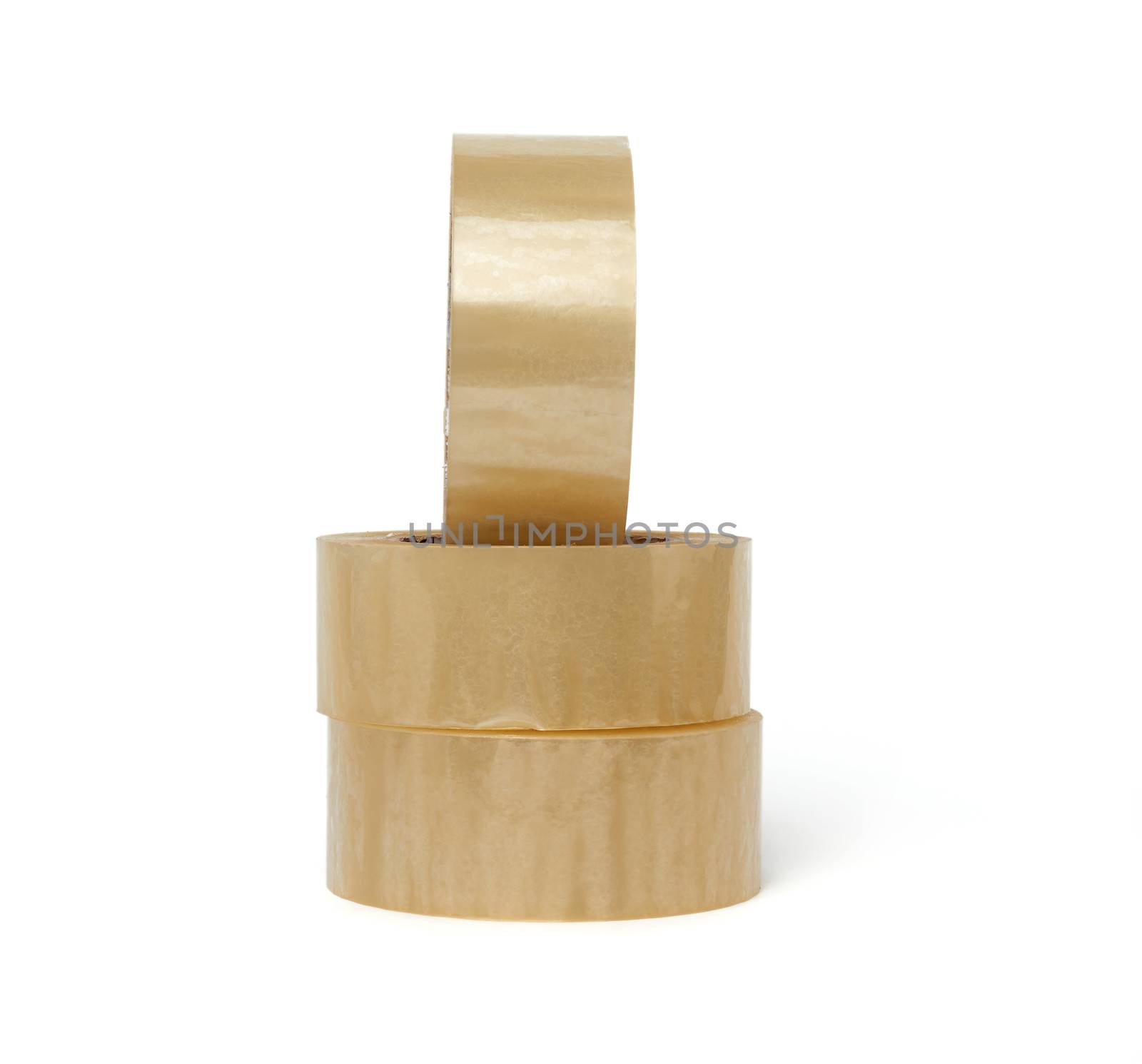 stack of transparent adhesive tape in round winding isolated on a white background, close up