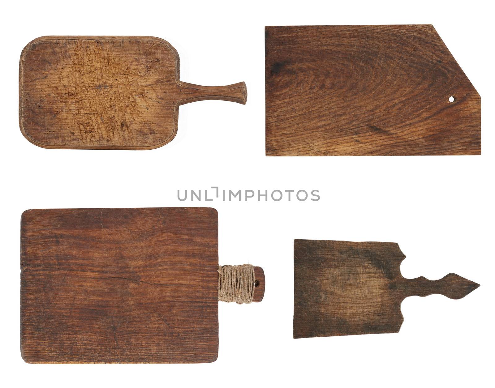 very old brown rectangular wooden kitchen cutting board with handle, utensils isolated on a white background, set