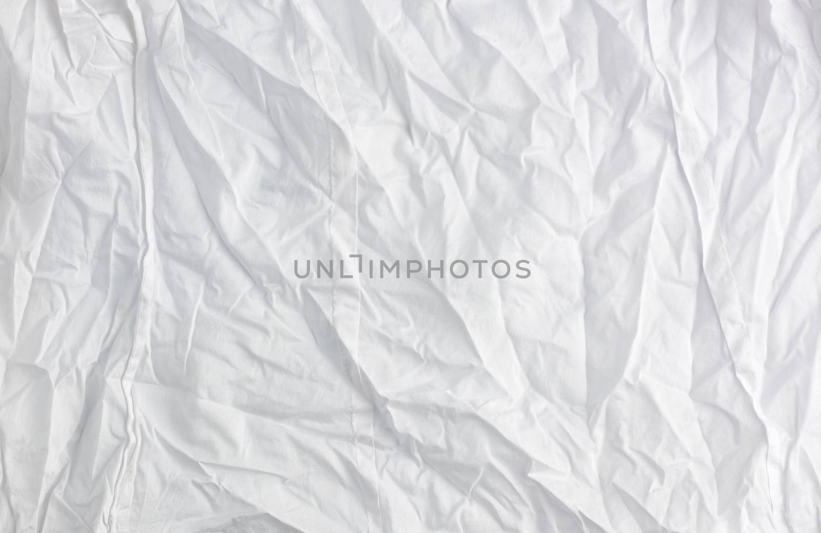 crumpled white cotton fabric, fabric for sewing clothes and shirts, full frame