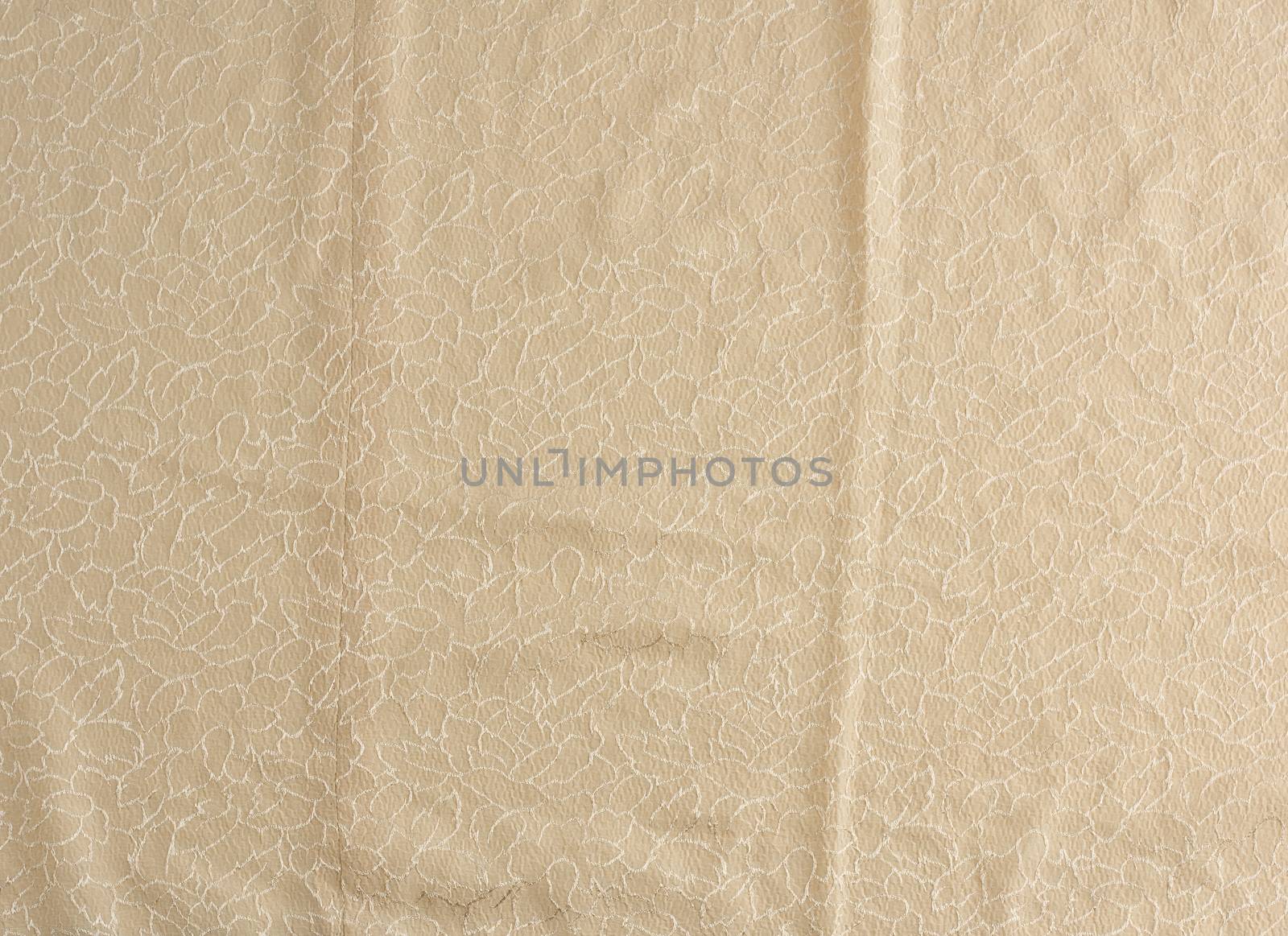 beige satin textile fabric with embroidery elements, piece of canvas for sewing curtains and things, full frame. Crumpled textile satin, great design for any purposes.