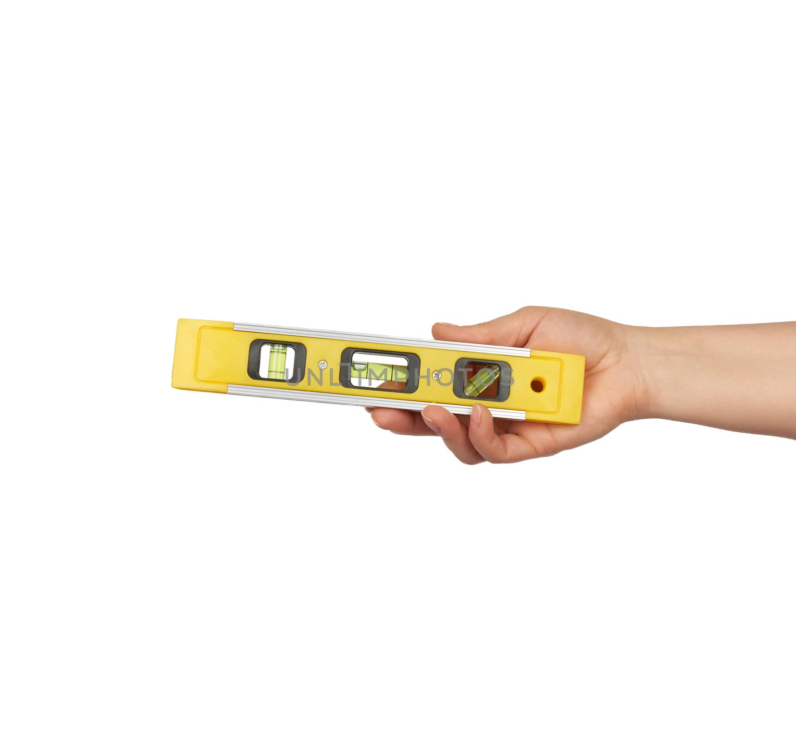female hand hold plastic yellow level tool with capsules isolated on white background, close up