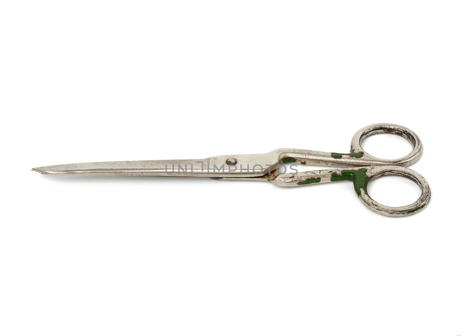 very old vintage metal tailor scissors isolated on a white background, close up