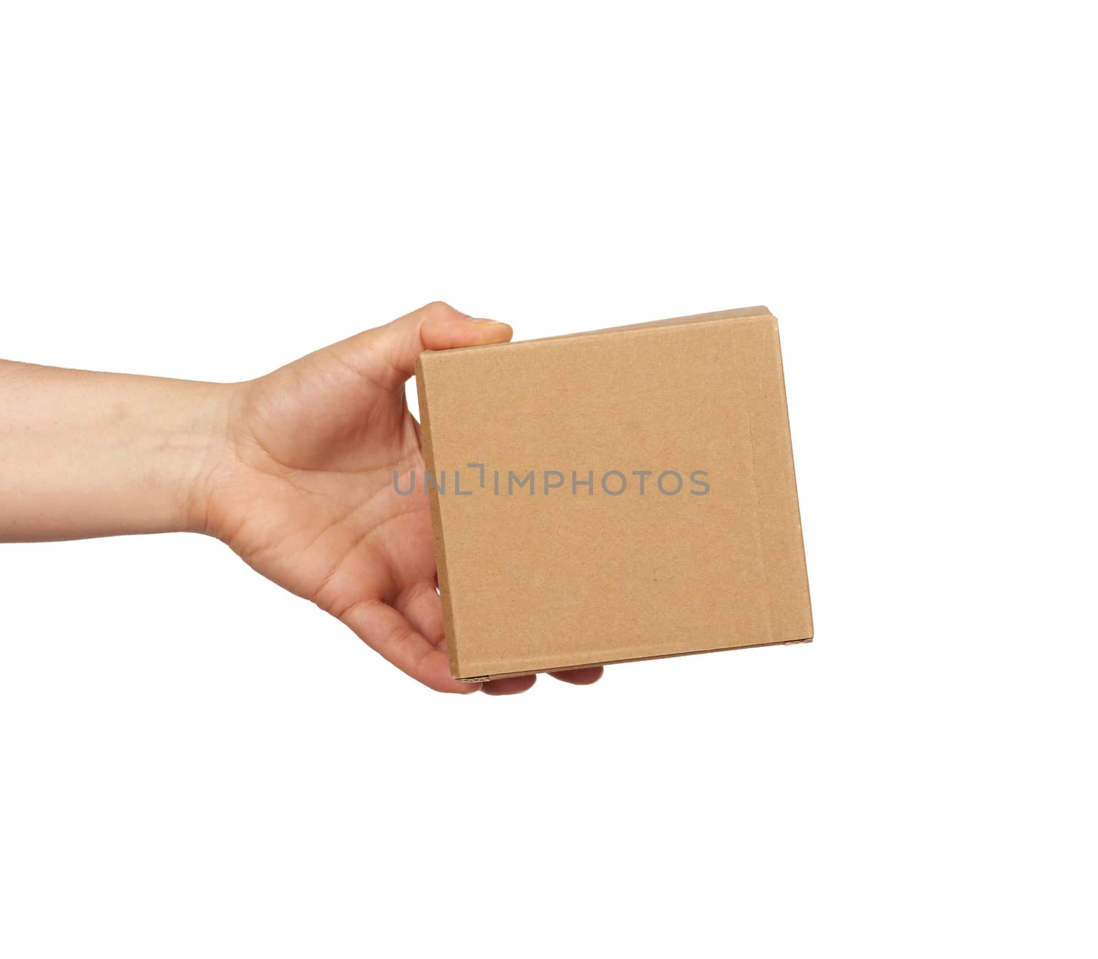 hand holds a brown cardboard box of paper on a white isolated background, close up