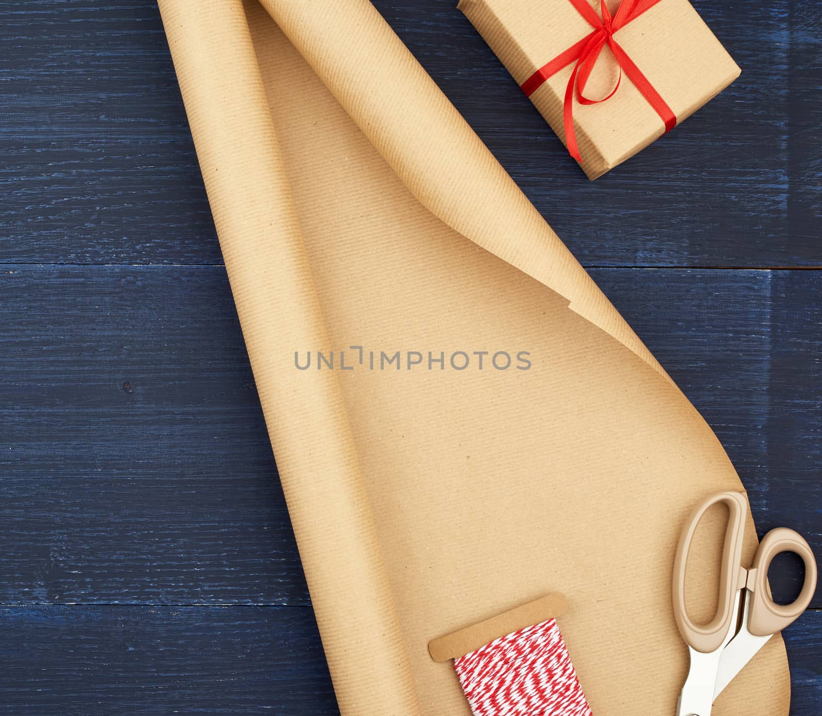 brown kraft paper, packed gift box and tied with a red ribbon, red heart, set of items. Gift wrapping. Package design
