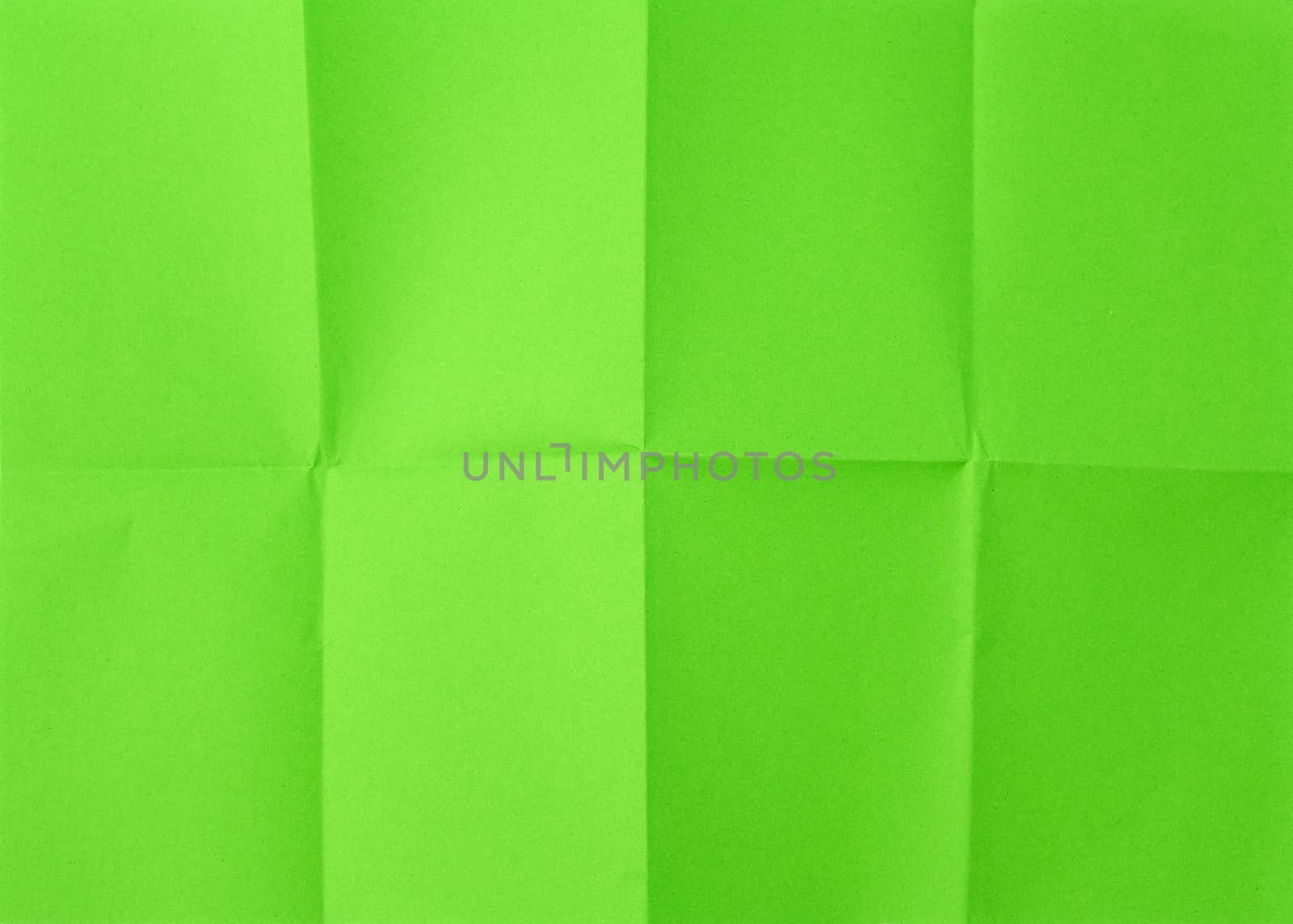 empty green sheet of paper with creases full frame, close up