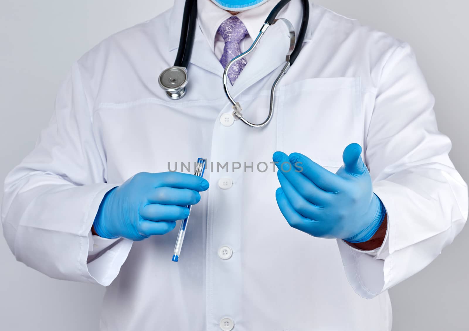 doctor in a white coat with buttons and blue latex gloves holds out his hand forward, concept of invitation, handshake, white background