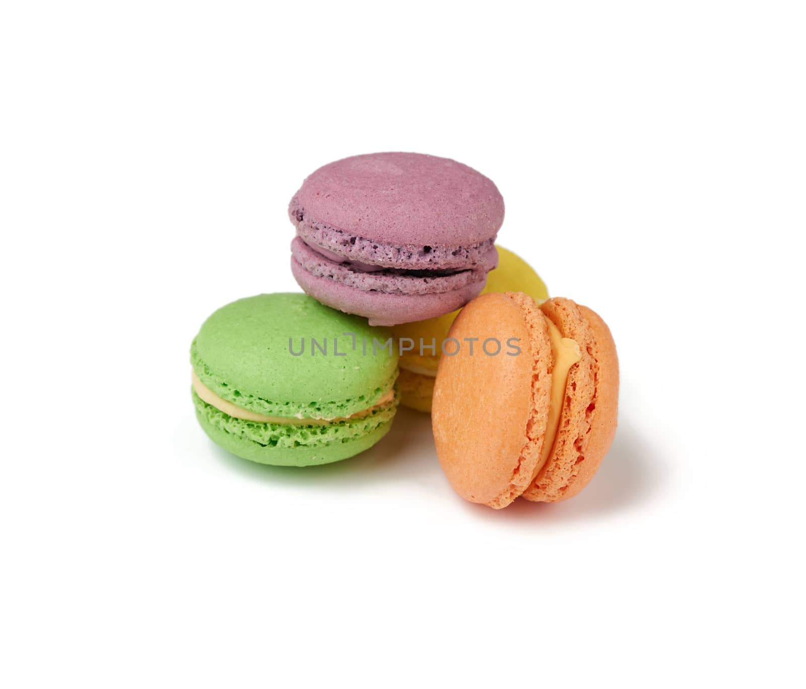 round baked multi-colored almond flour cakes macarons, dessert isolated on a white background, close up