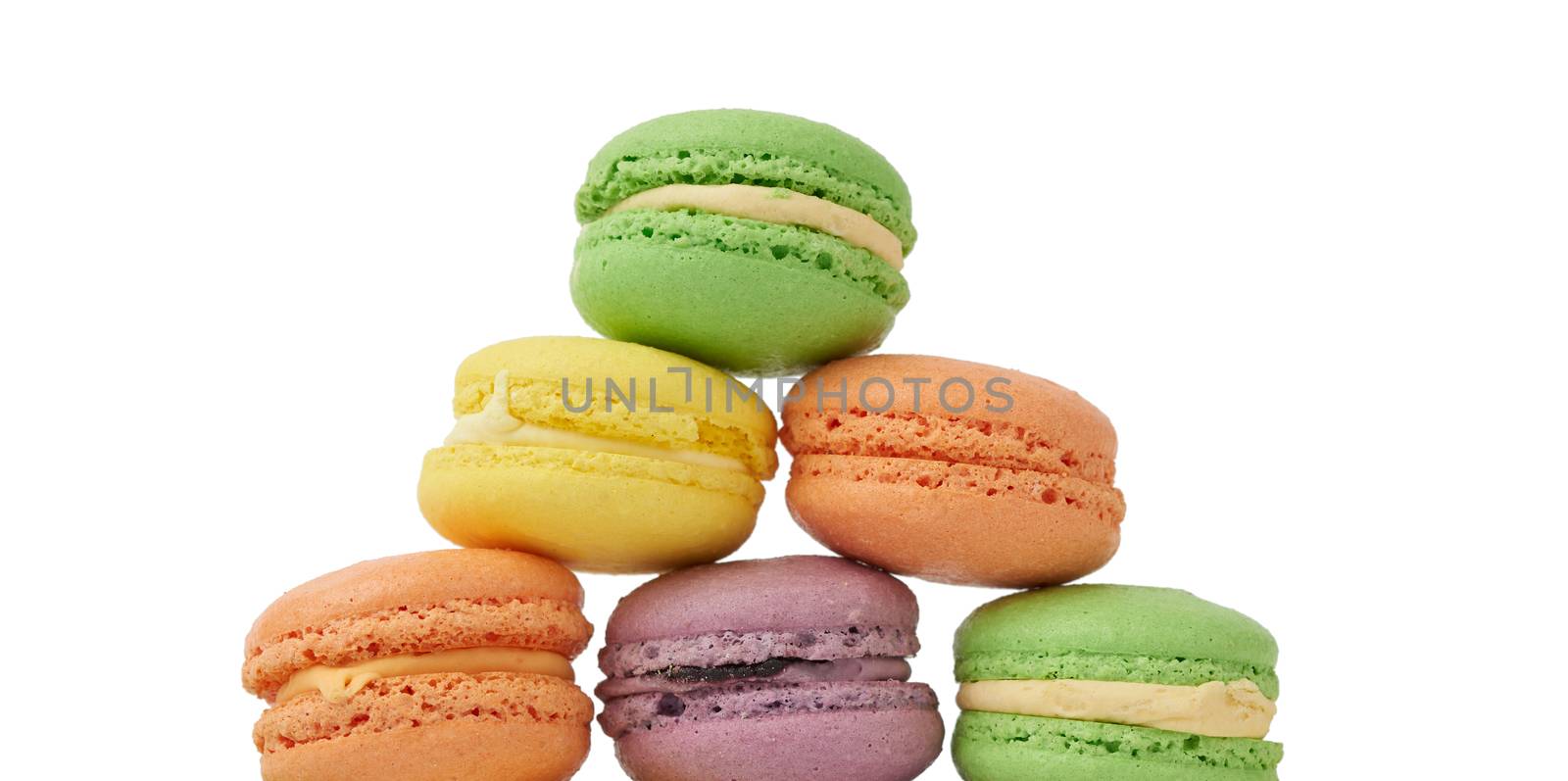 round baked multi-colored almond flour cakes macarons, dessert isolated on a white background