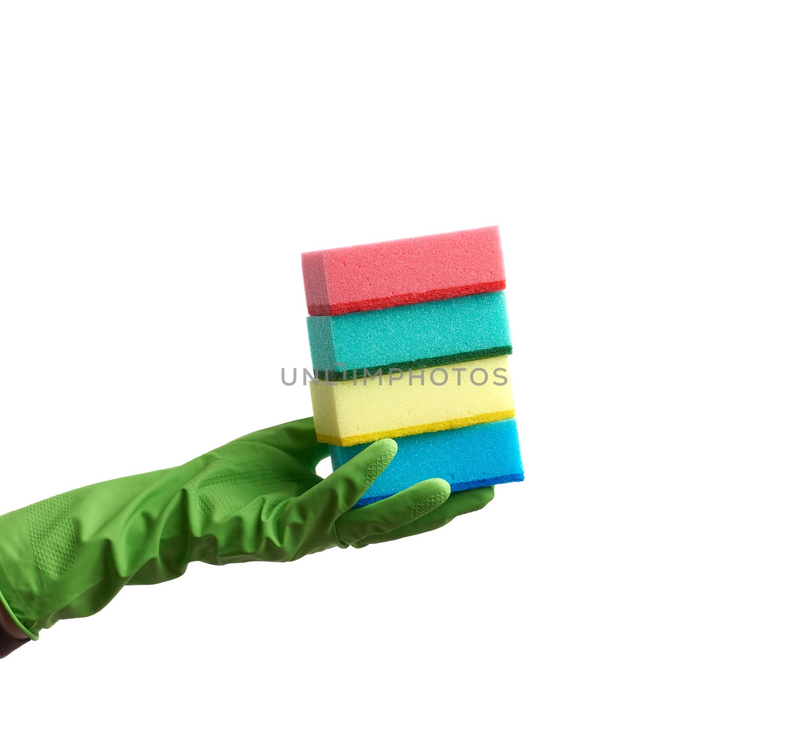 wearing a green glove for cleaning and washing dishes, red and yellow kitchen sponges  lies in the palm of hand, part of the body is isolated on a white background