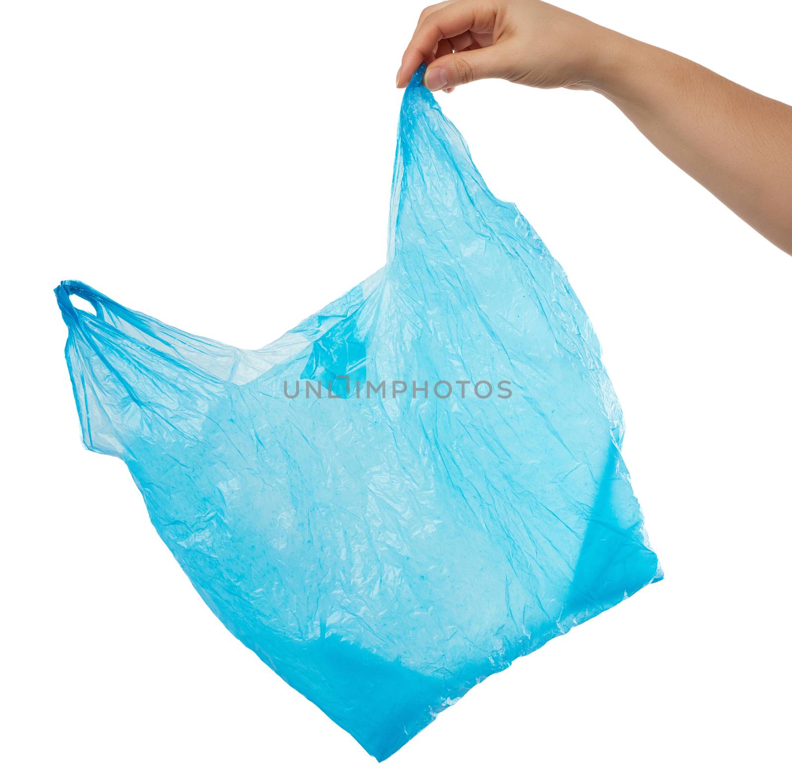 hand holds an empty blue plastic bag on a white background, concept of rejection of plastic and the transition to eco-packaging